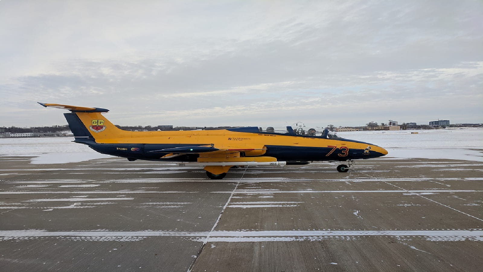 Yellow plane on snowy runway