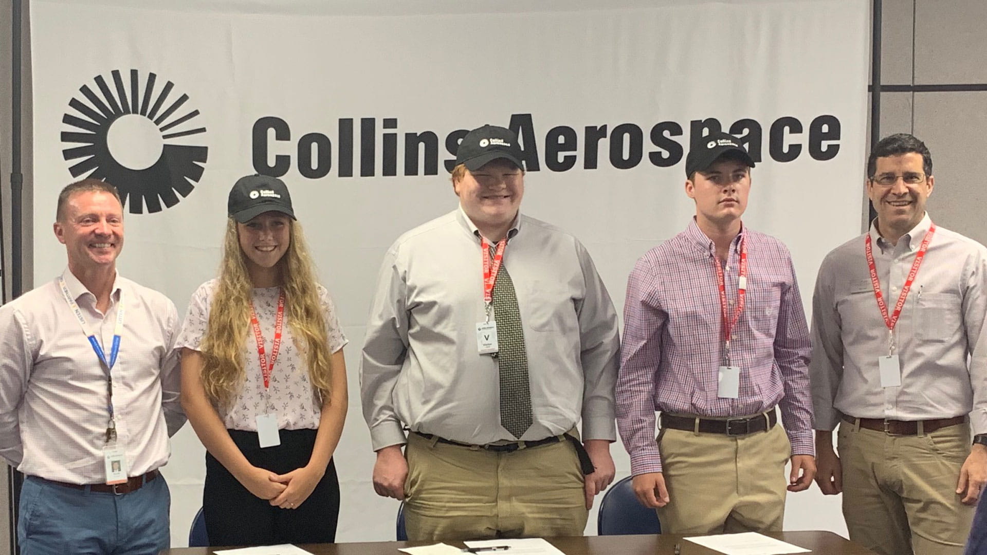 High Schoolers at Collins Aerospace apprenticeship signing ceremony