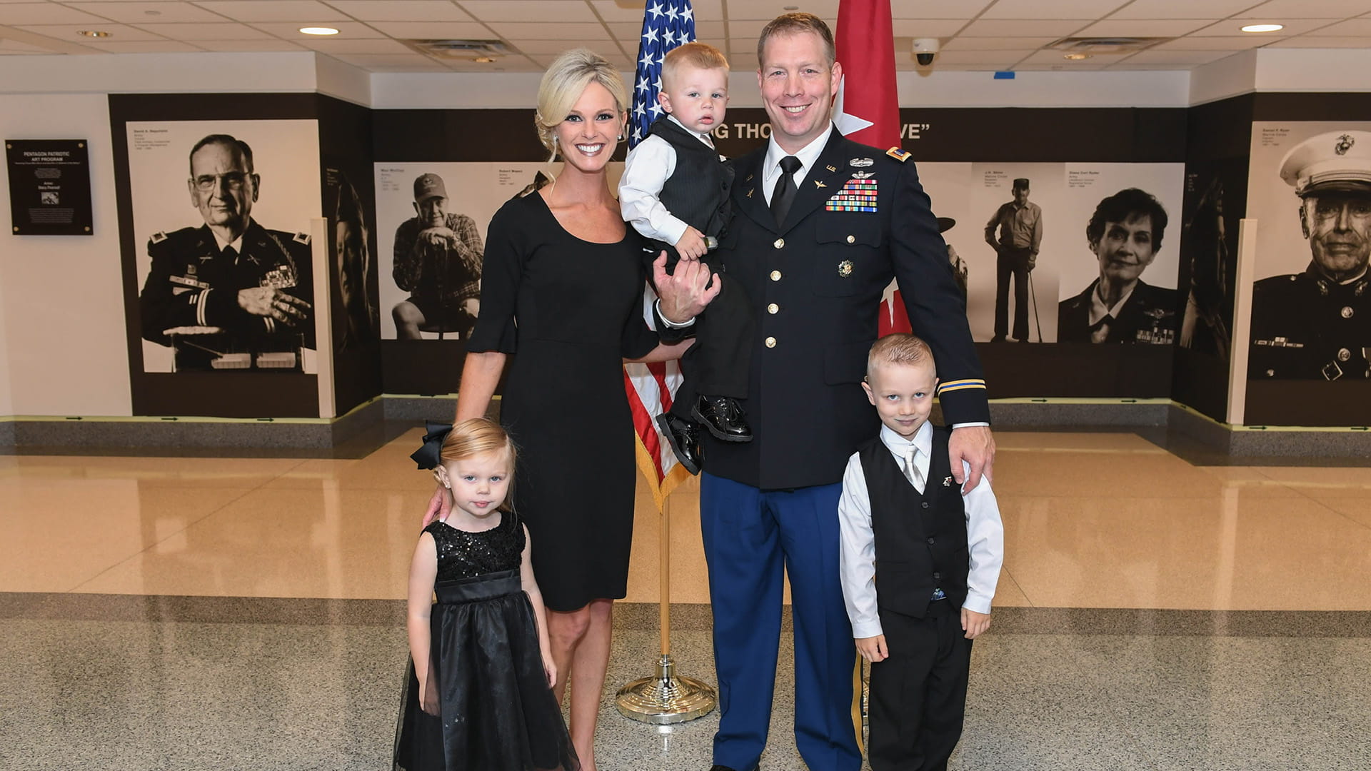 Chadwick Ford in dress uniform with wife and three kids