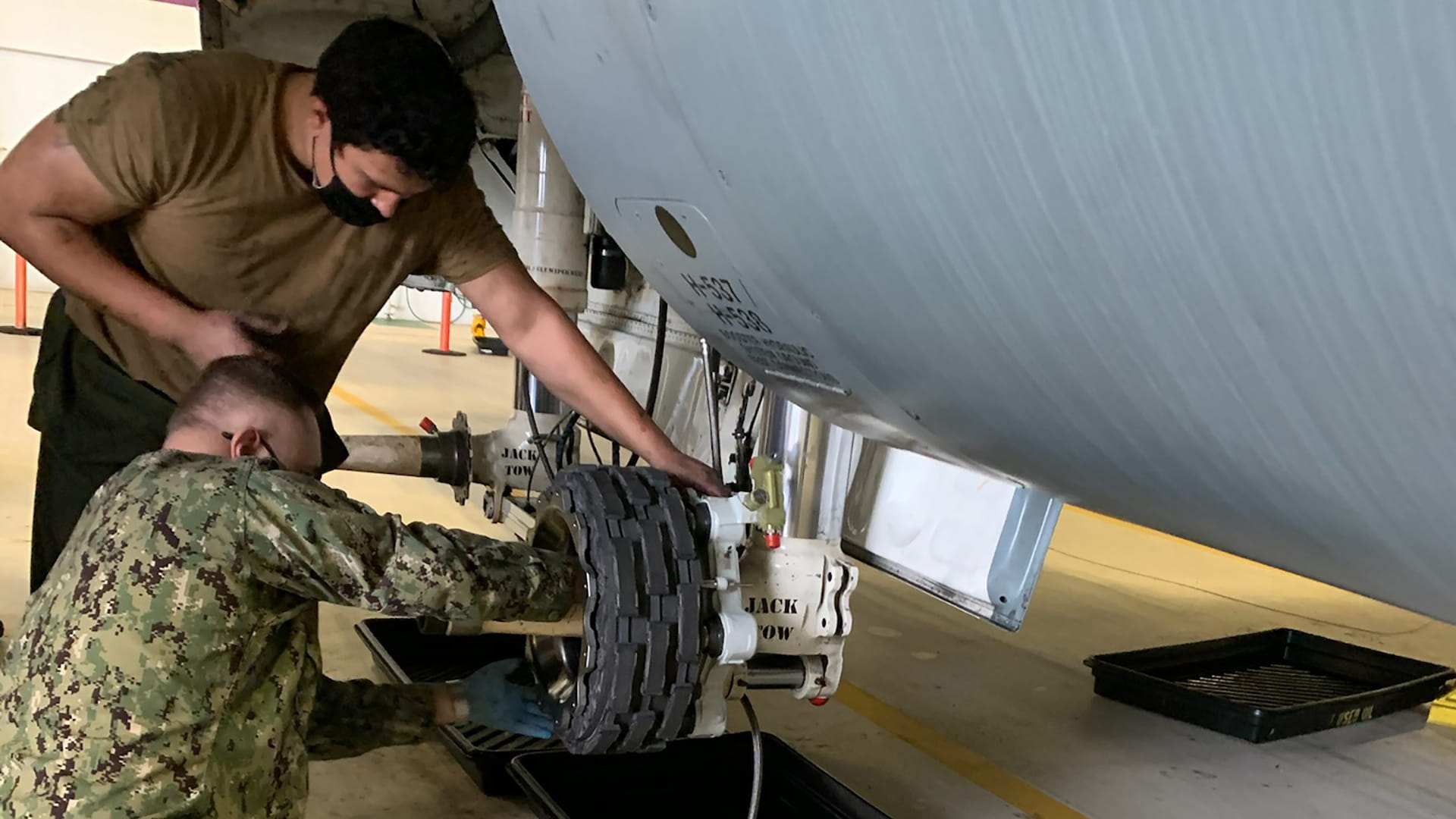 U.S. Marine Corps maintainers install Collins wheels and brakes on a C-130 at Navy Air Station New Orleans.