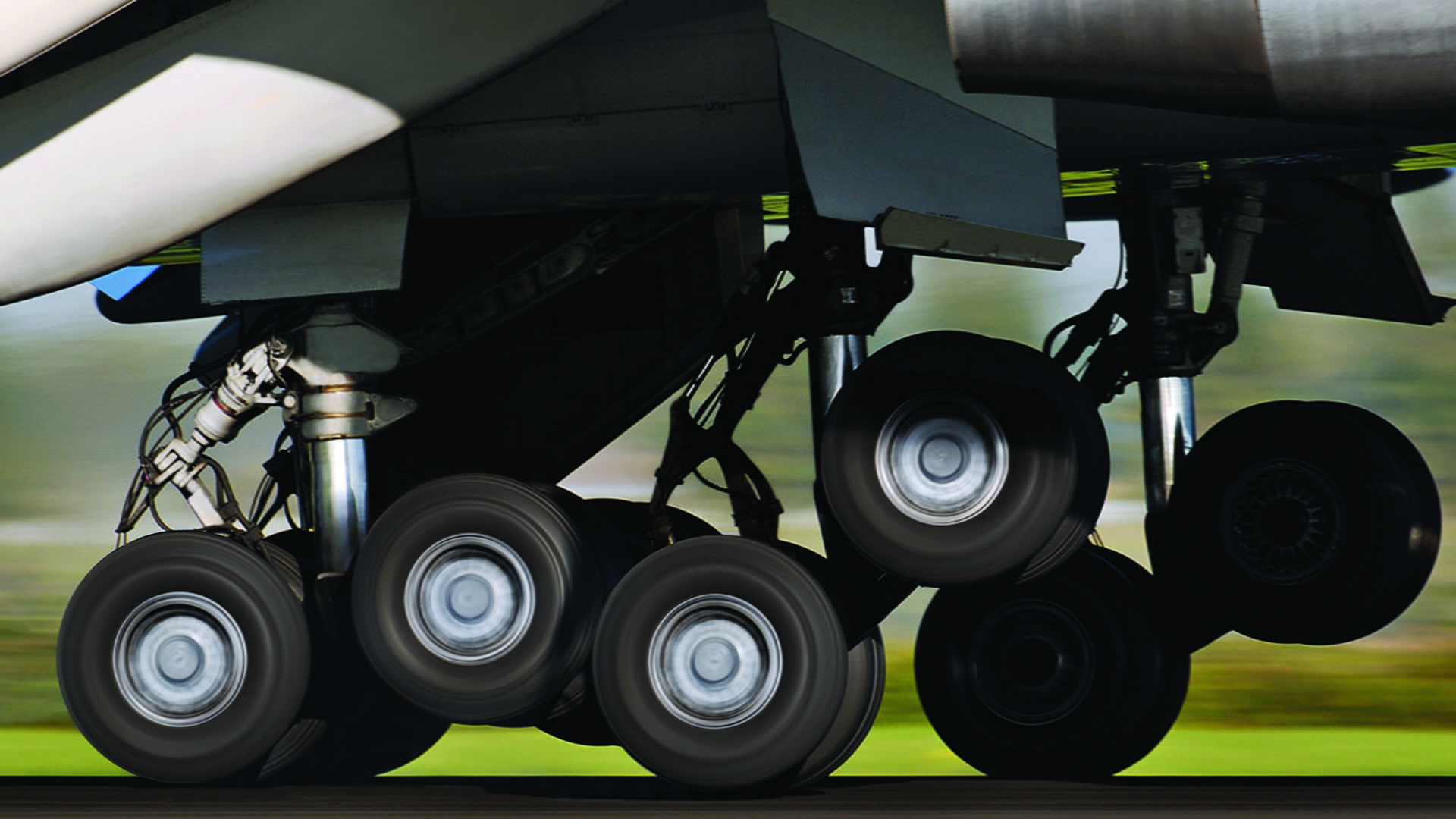 black and white photo of airplane landing gear in use