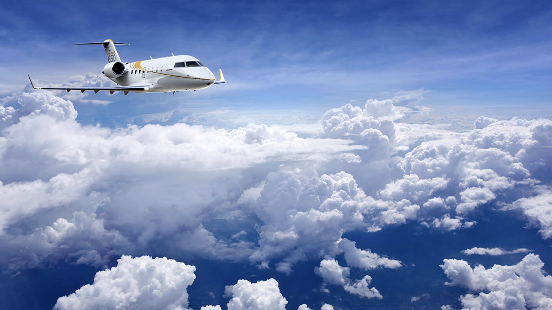 Bombardier 605-650 Plane above the clouds
