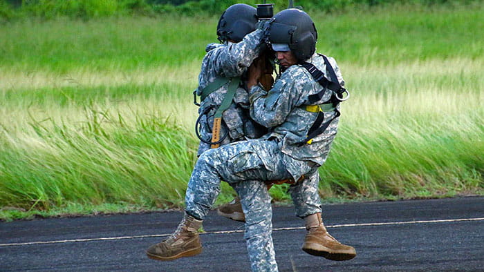 Two soldiers participating in rescue hoist training