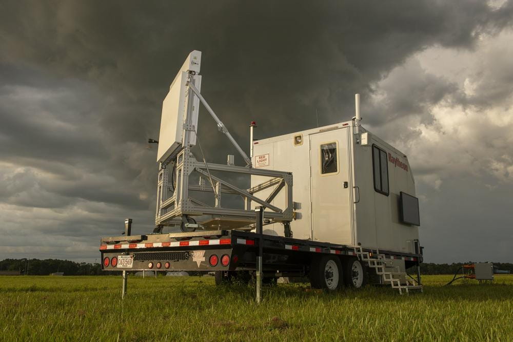 A weather event surrounds Raytheon Technologies’ Skyler radar as it senses the storm in the distance.