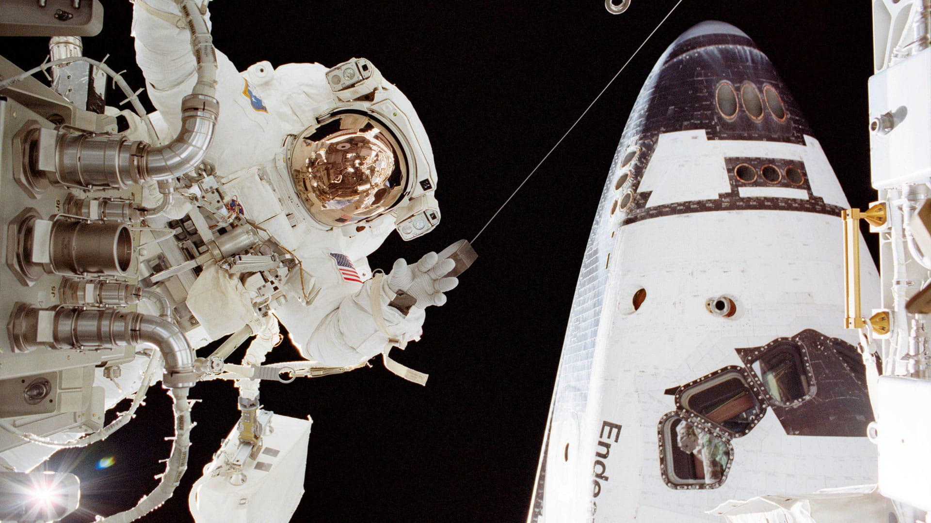 Astronaut outside space shuttle Endeavour
