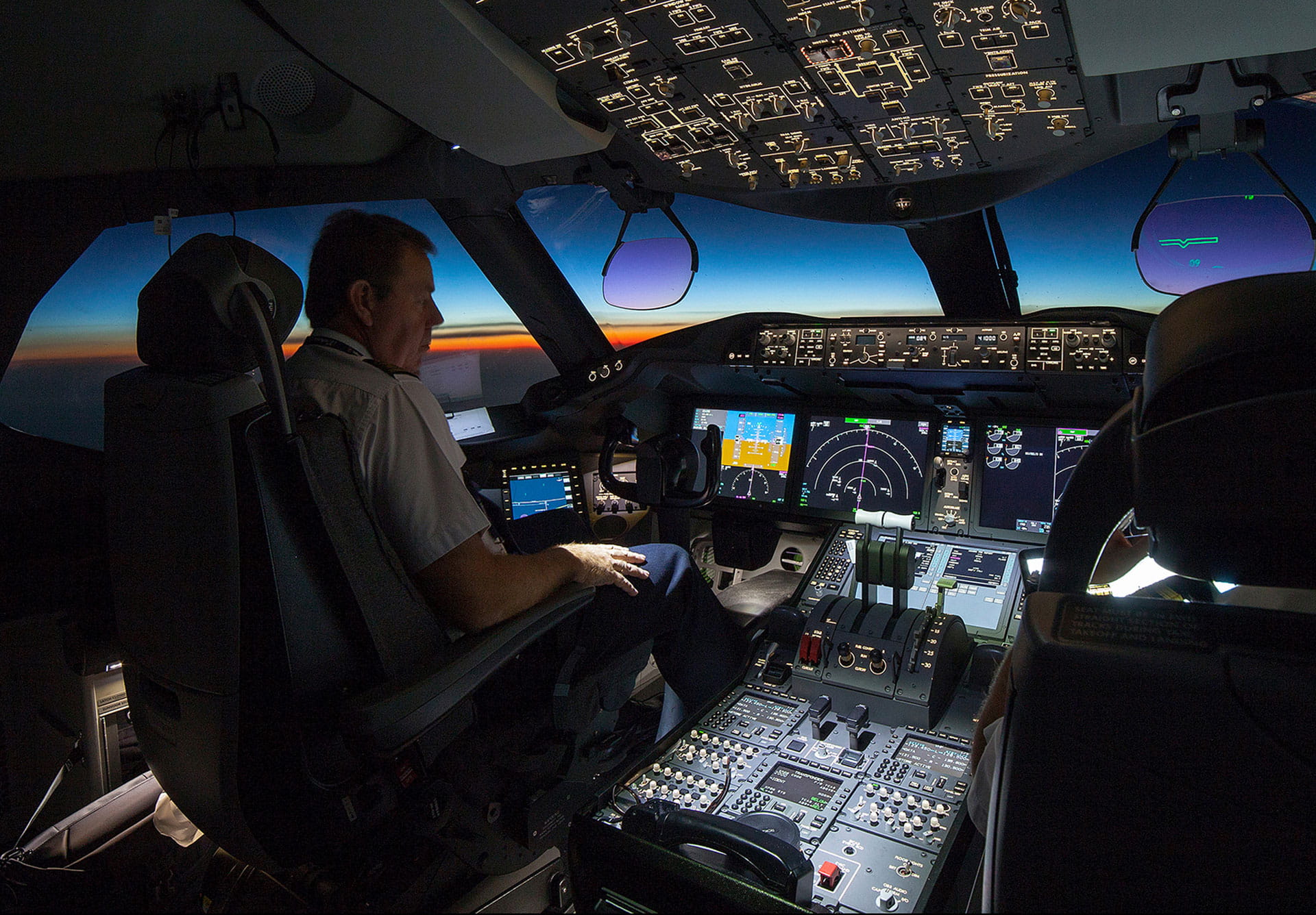 Pilot sitting in an aircraft flight deck