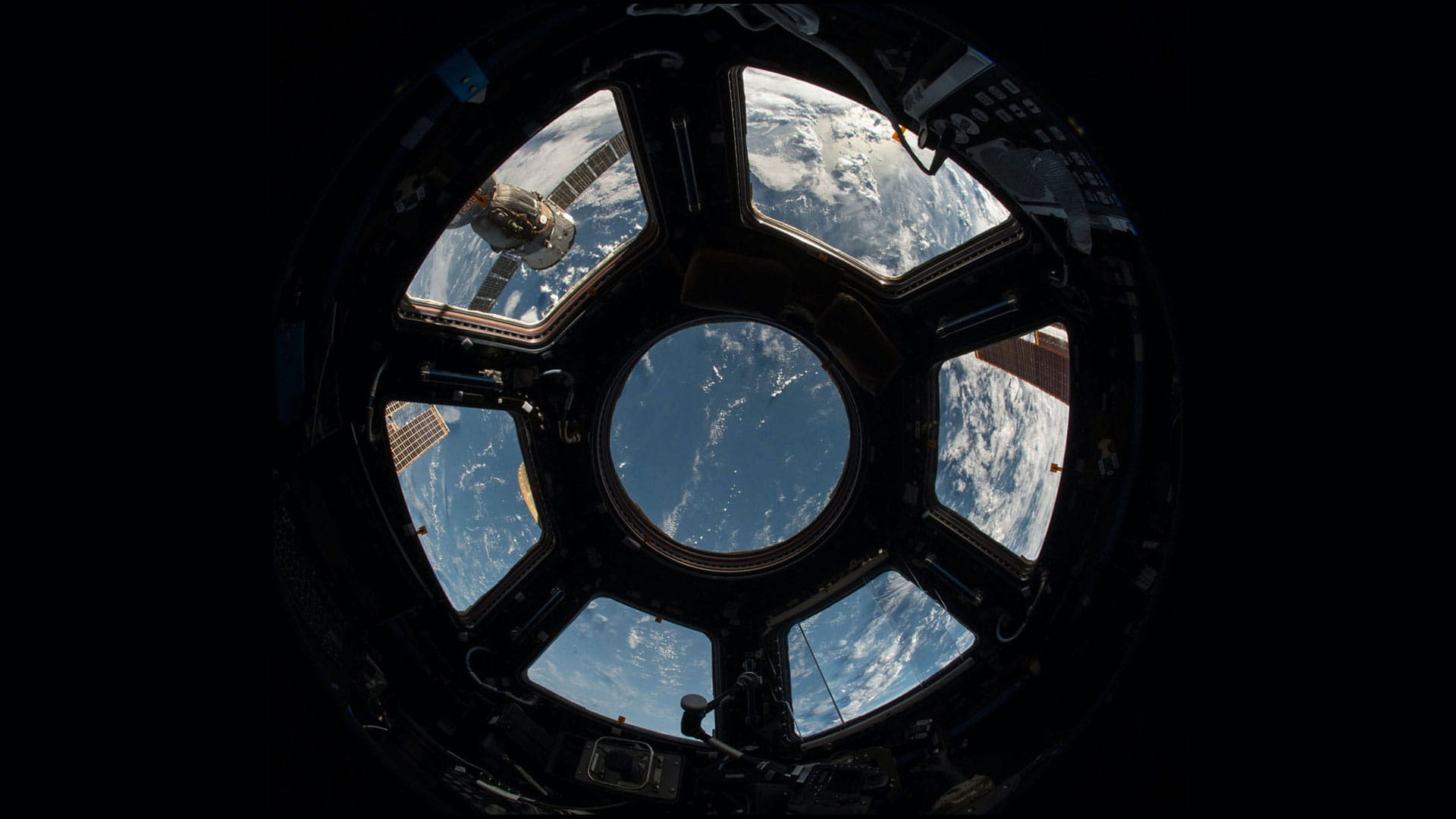 A view of Earth outside a window on the International Space Station