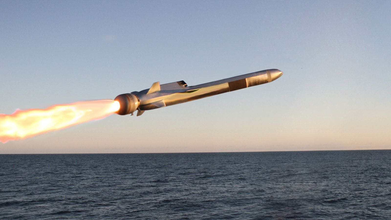 Naval air strike missile skimming across water