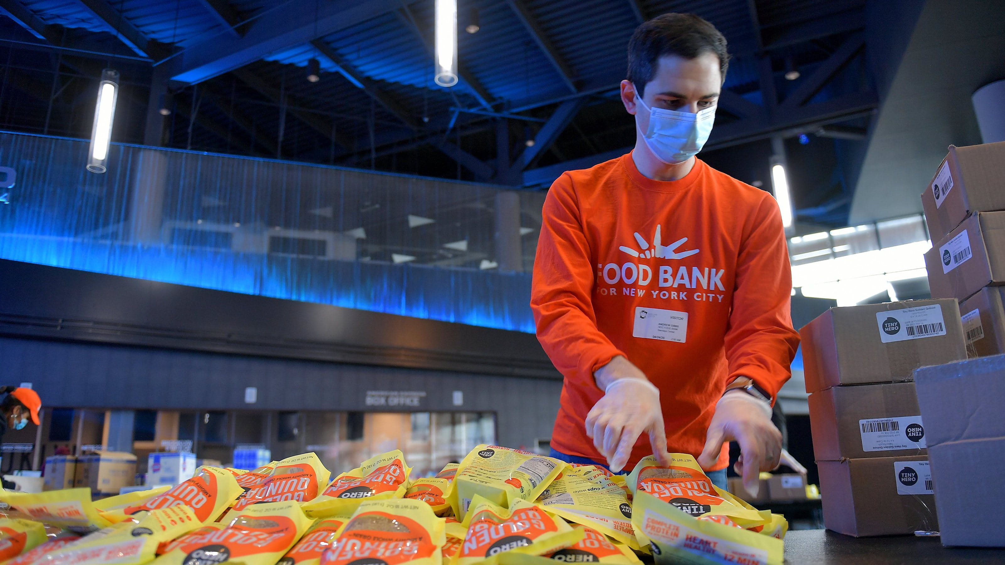 A volunteer works at the Food Bank for New York City