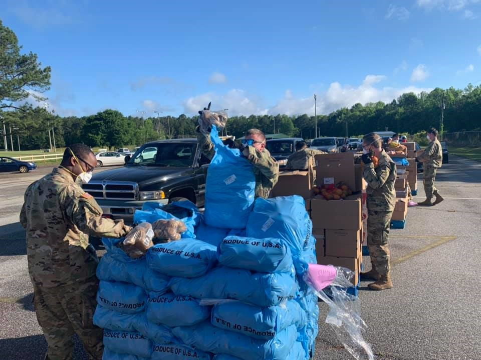 Members of the Georgia Army National Guard pack produce at a drive-up food distribution in Hamilton, Georgia, in April 2020. The COVID-19 pandemic has increased demand for food assistance dramatically. (Photo courtesy Feeding the Valley)