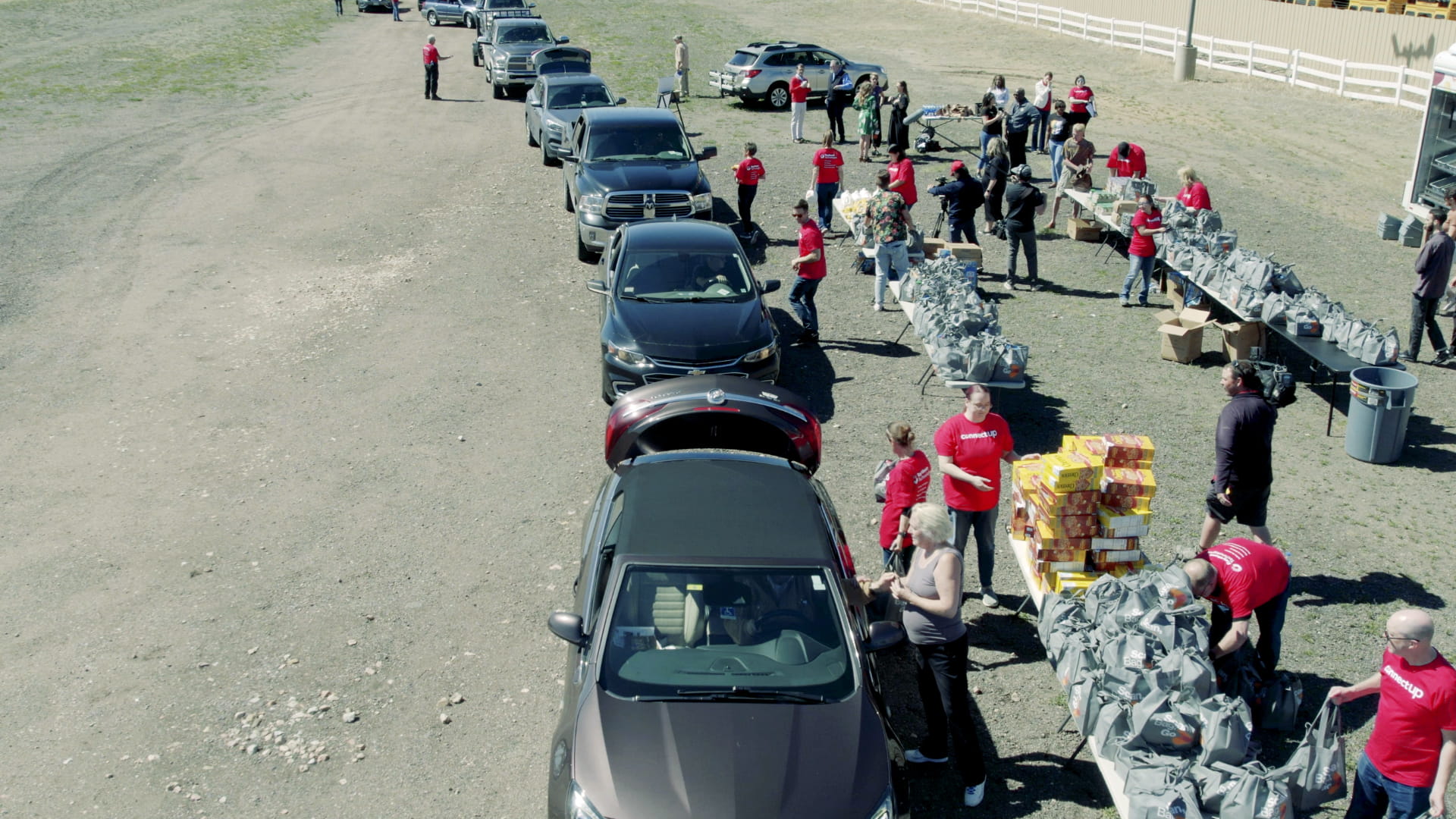 A group of people distributing food packages