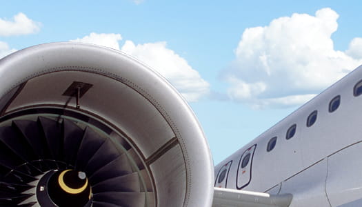 This is a close-up of a passenger jet engine and part of the fuselage. 