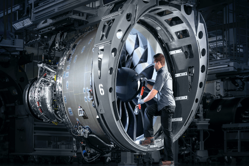 Worker inside an engine, helping to build it