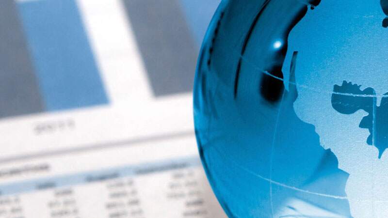 glass paperweight in the shape of a blue globe