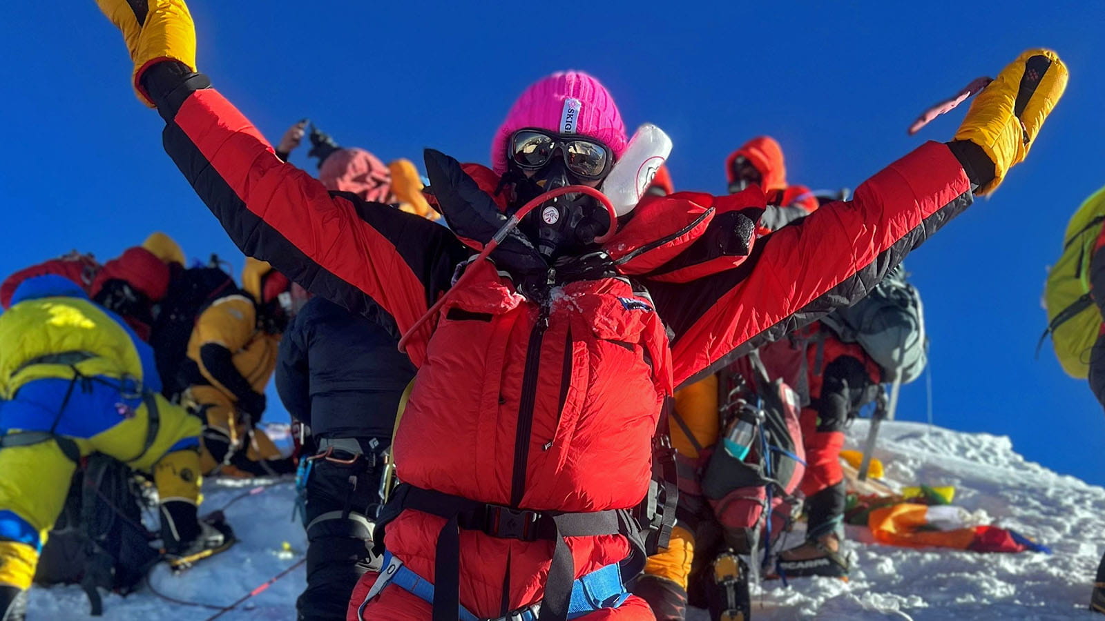 Buchanan raises her arm in victory a few feet below the summit of Mount Everest, Nepal, May 12, 2022.