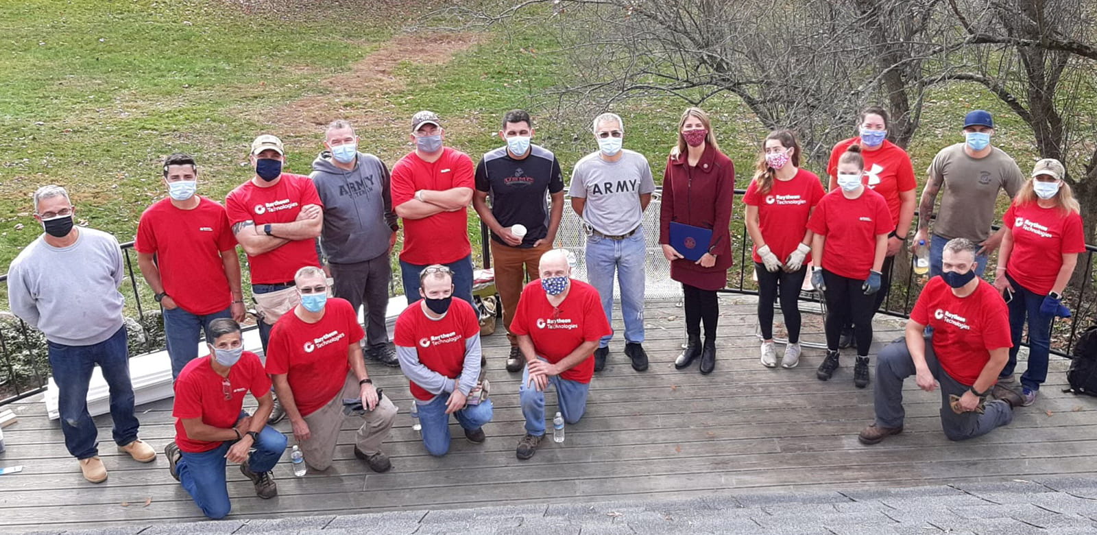 Raytheon employees volunteering at Ironstone Farm.